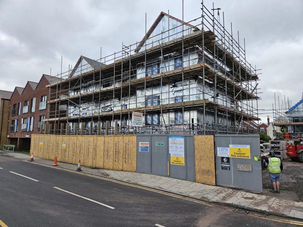 Building under construction with scaffolding around it